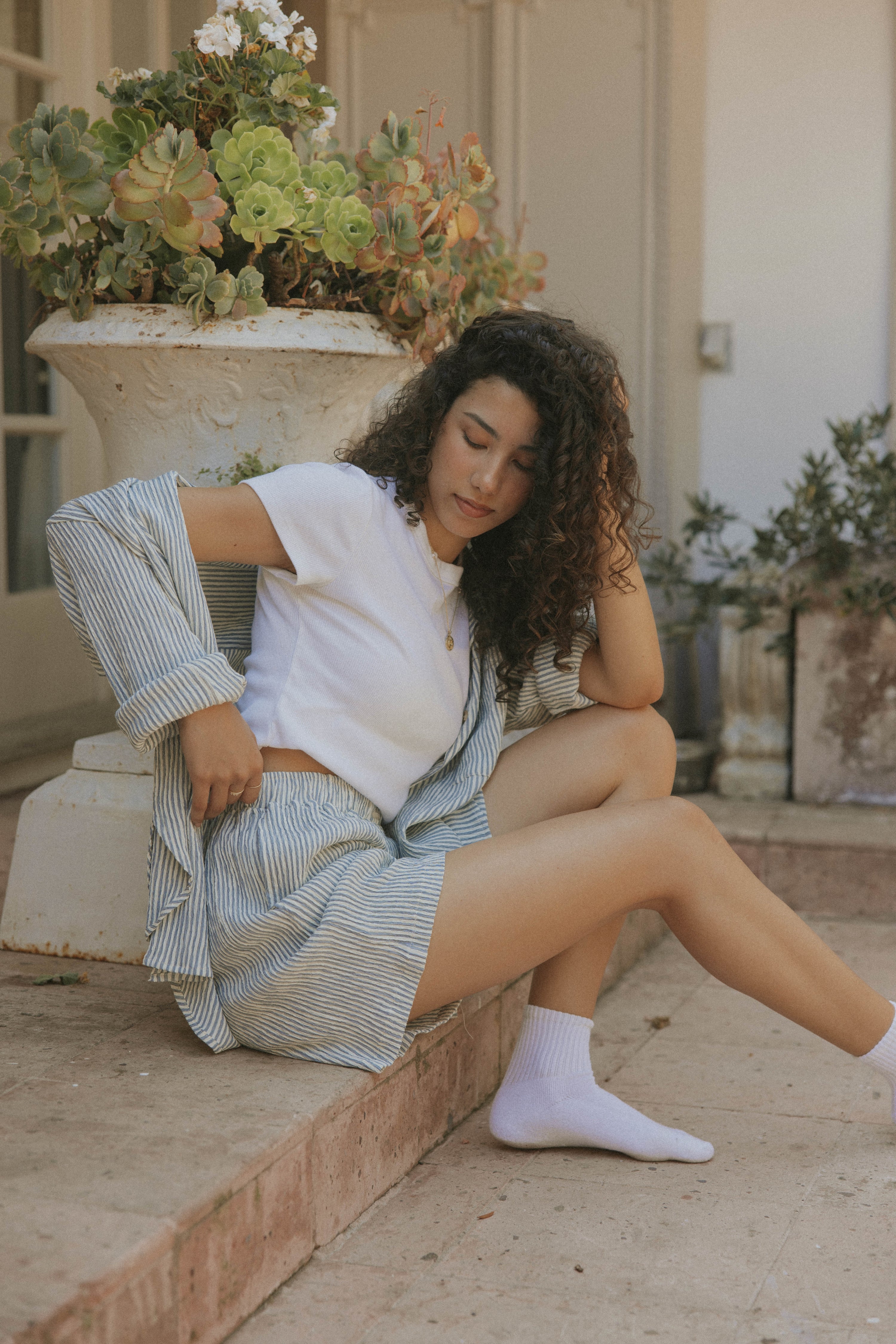 Striped matching shorts and top set for women.
