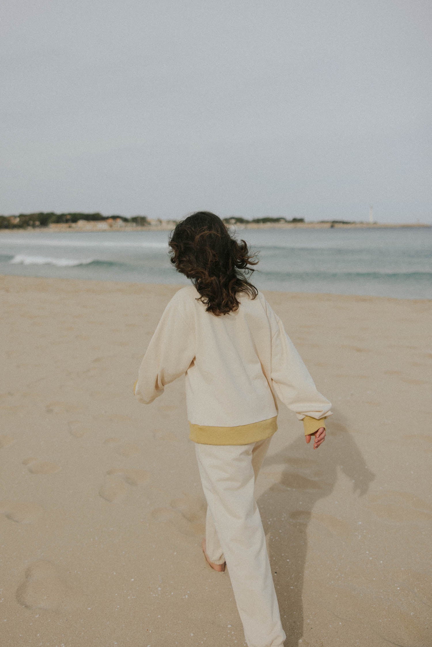 Matching neutral sweatsuit set for women.