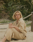 Brown muslin nursing-friendly top for women.