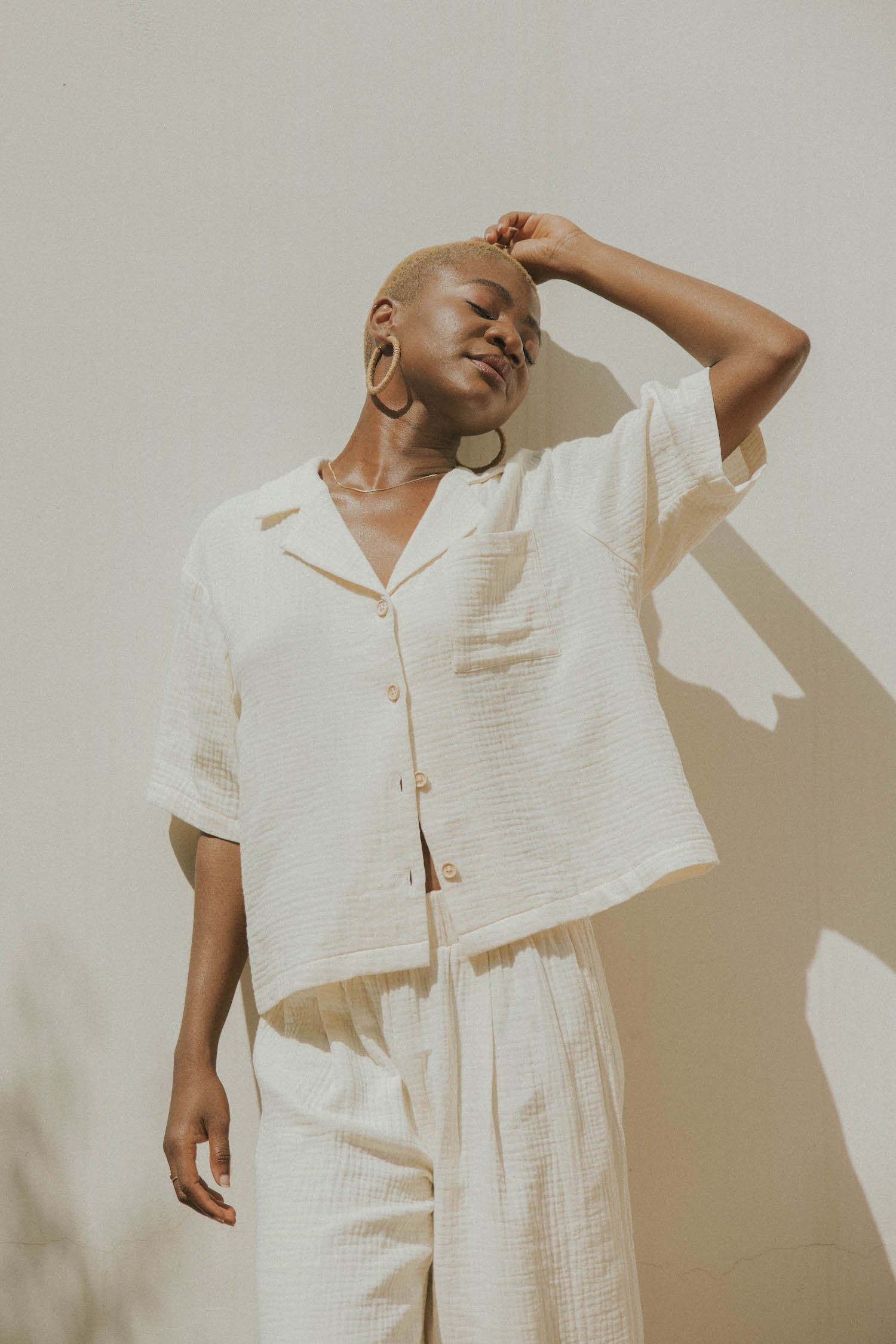 White muslin nursing-friendly top for women.