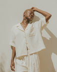 White muslin nursing-friendly top for women.