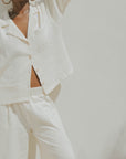 White muslin nursing-friendly top for women.