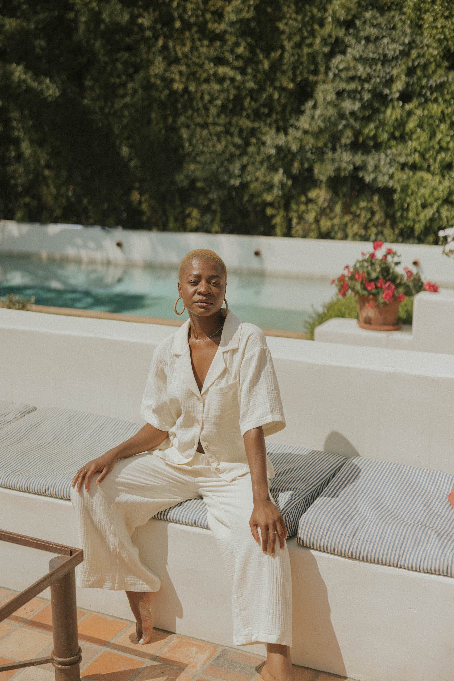 White muslin nursing-friendly top for women.