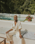 White muslin nursing-friendly top for women.