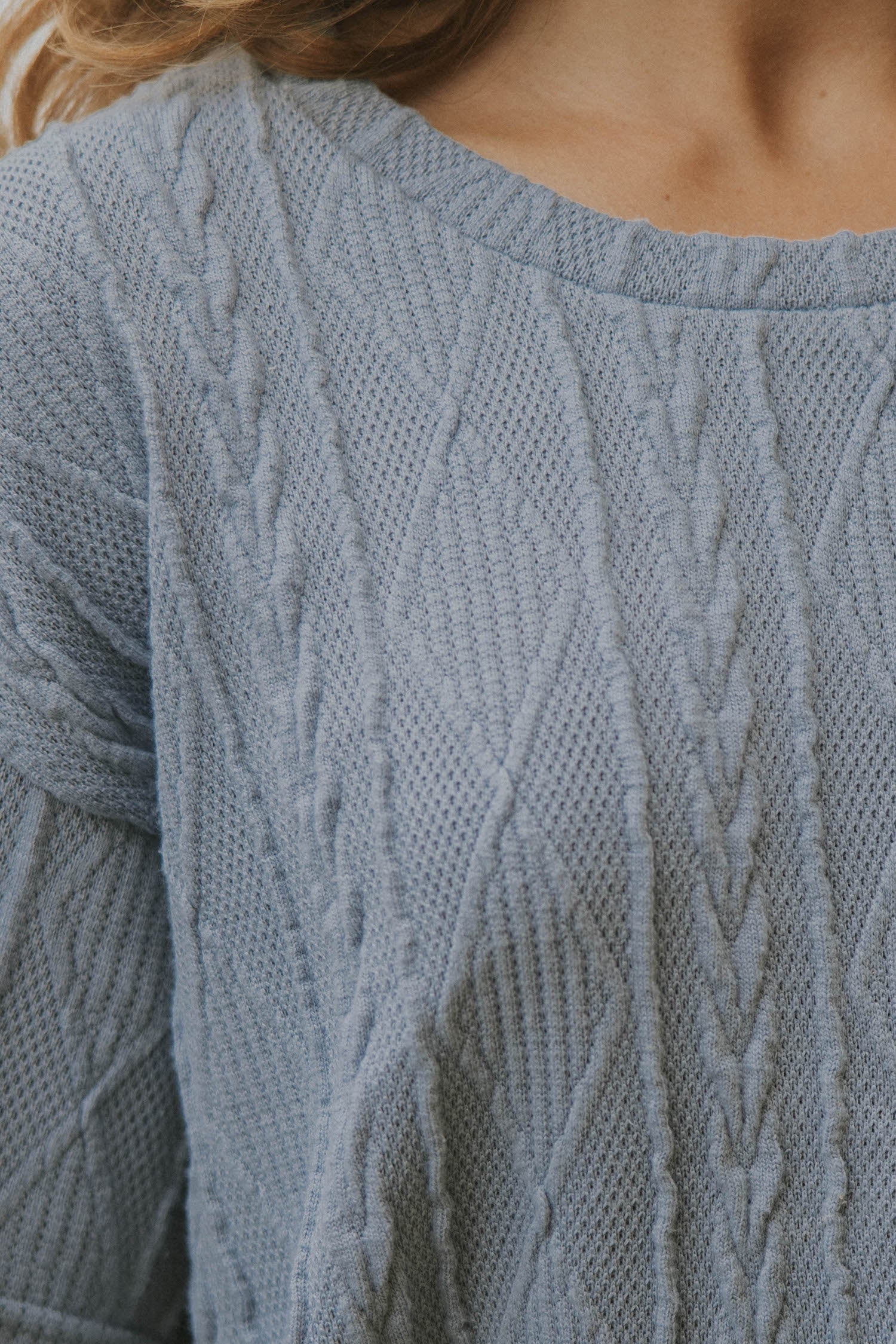 Cable knit sweater top for women.