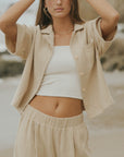 Brown muslin nursing-friendly top for women.