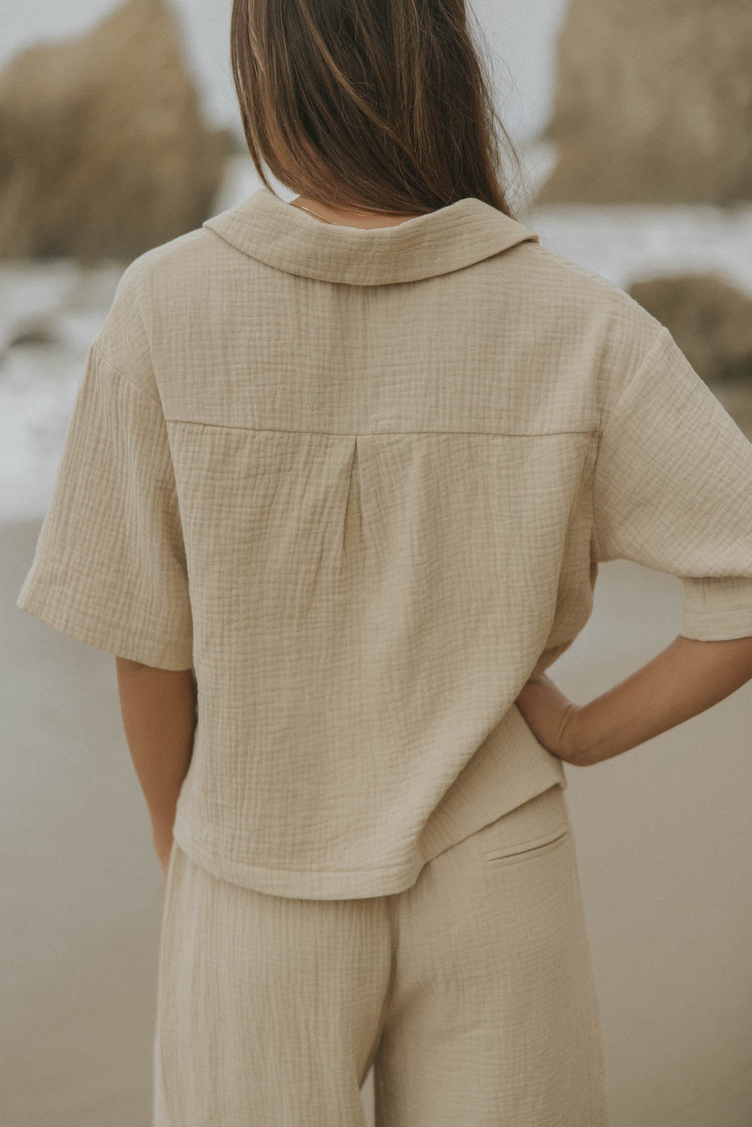 Brown muslin nursing-friendly top for women.