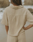 Brown muslin nursing-friendly top for women.