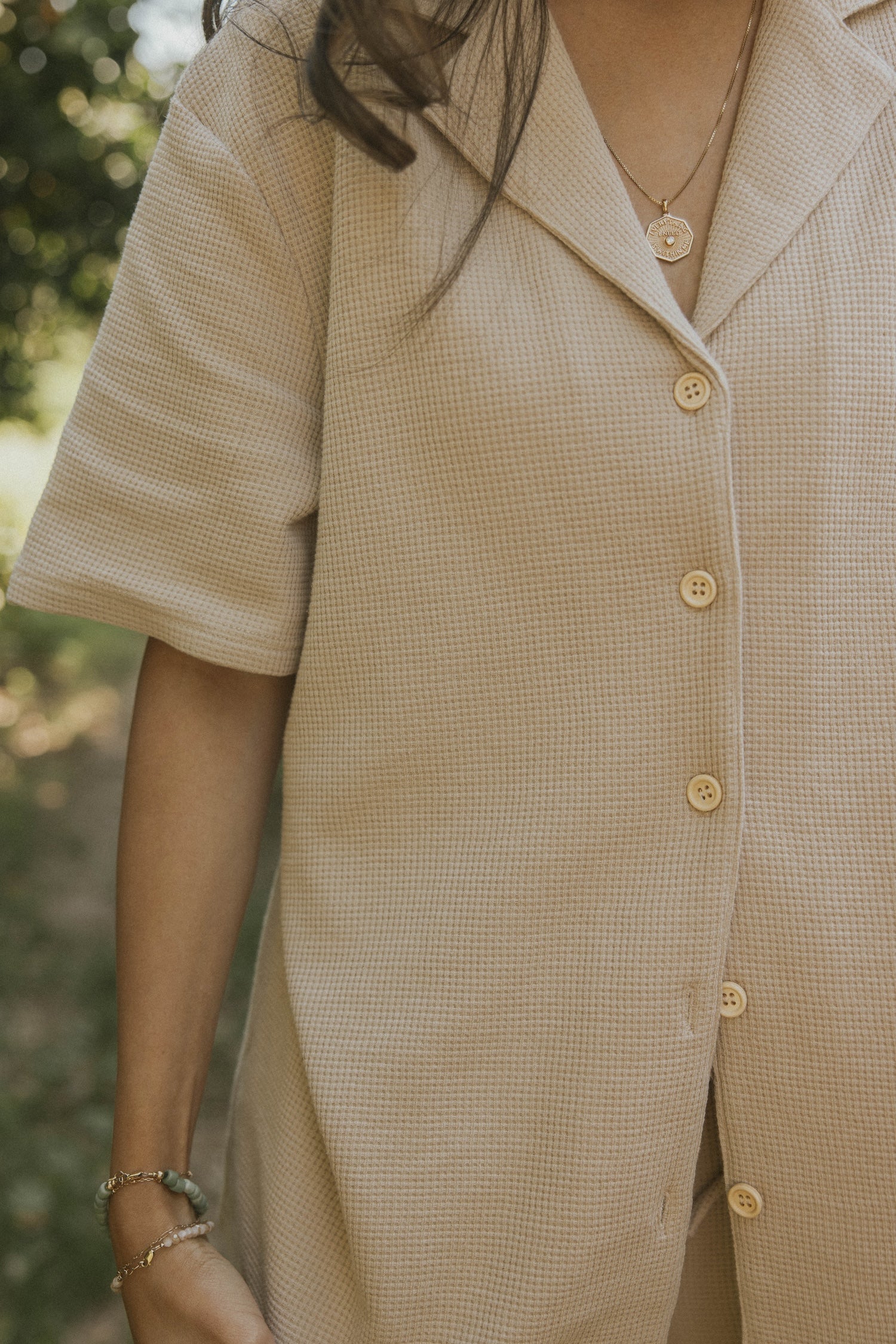 Women's neutral waffle knit shirt.