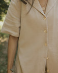 Women's neutral waffle knit shirt.
