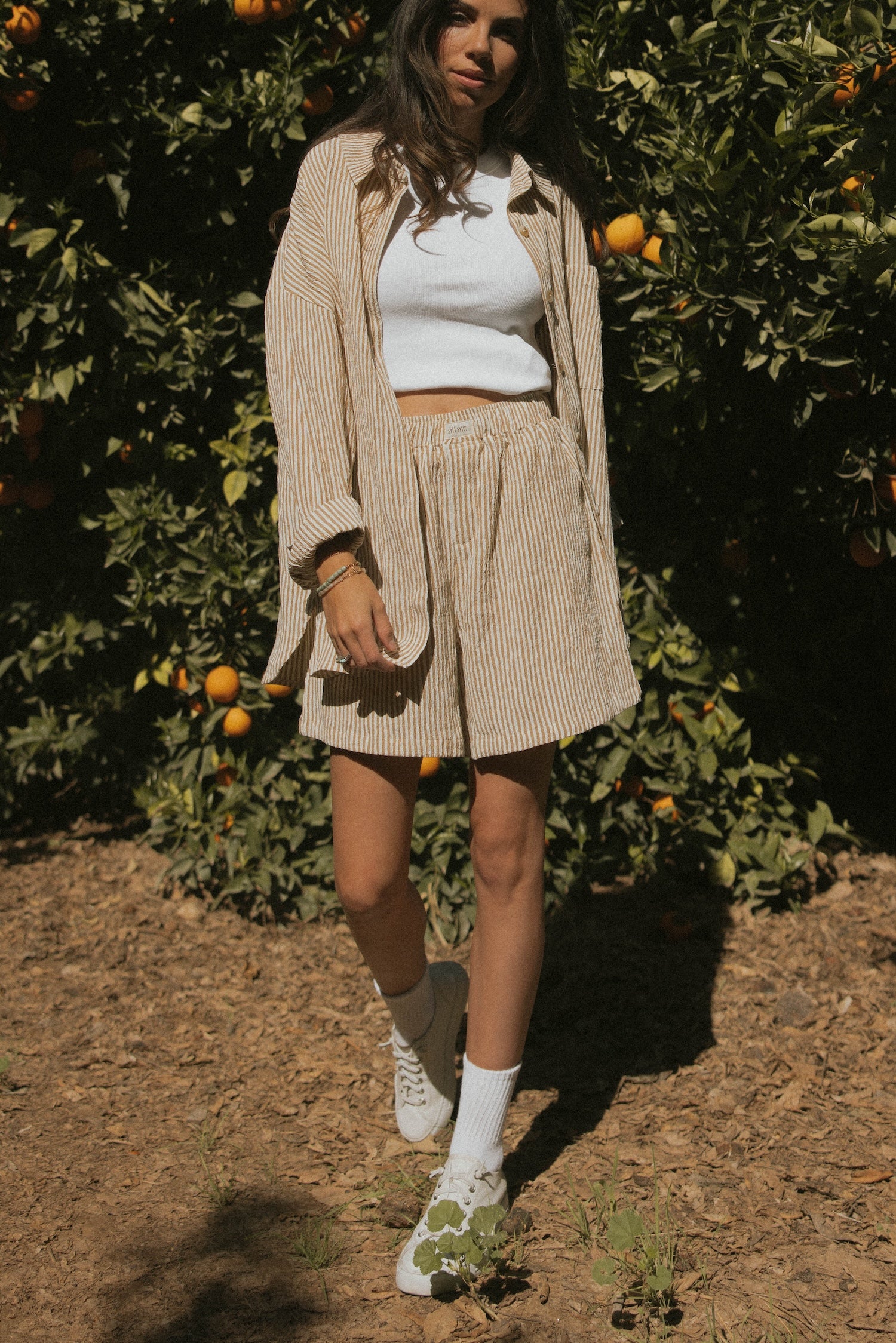 Striped matching shorts and top set for women.