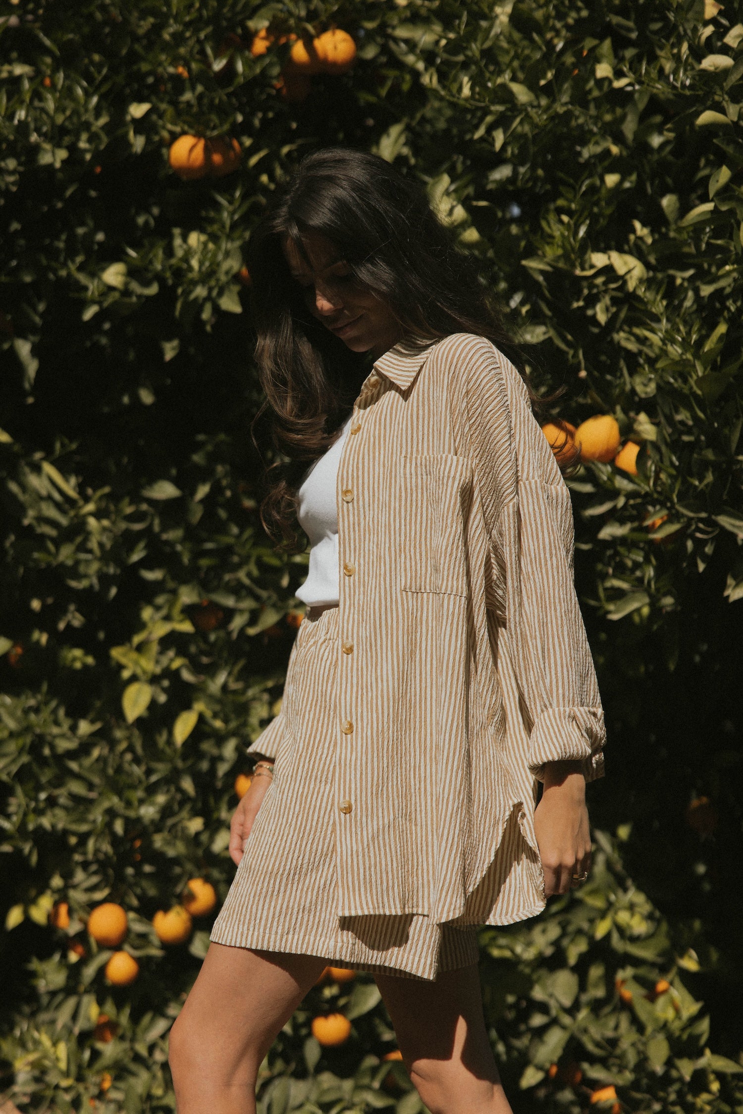 Striped matching shorts and top set for women.