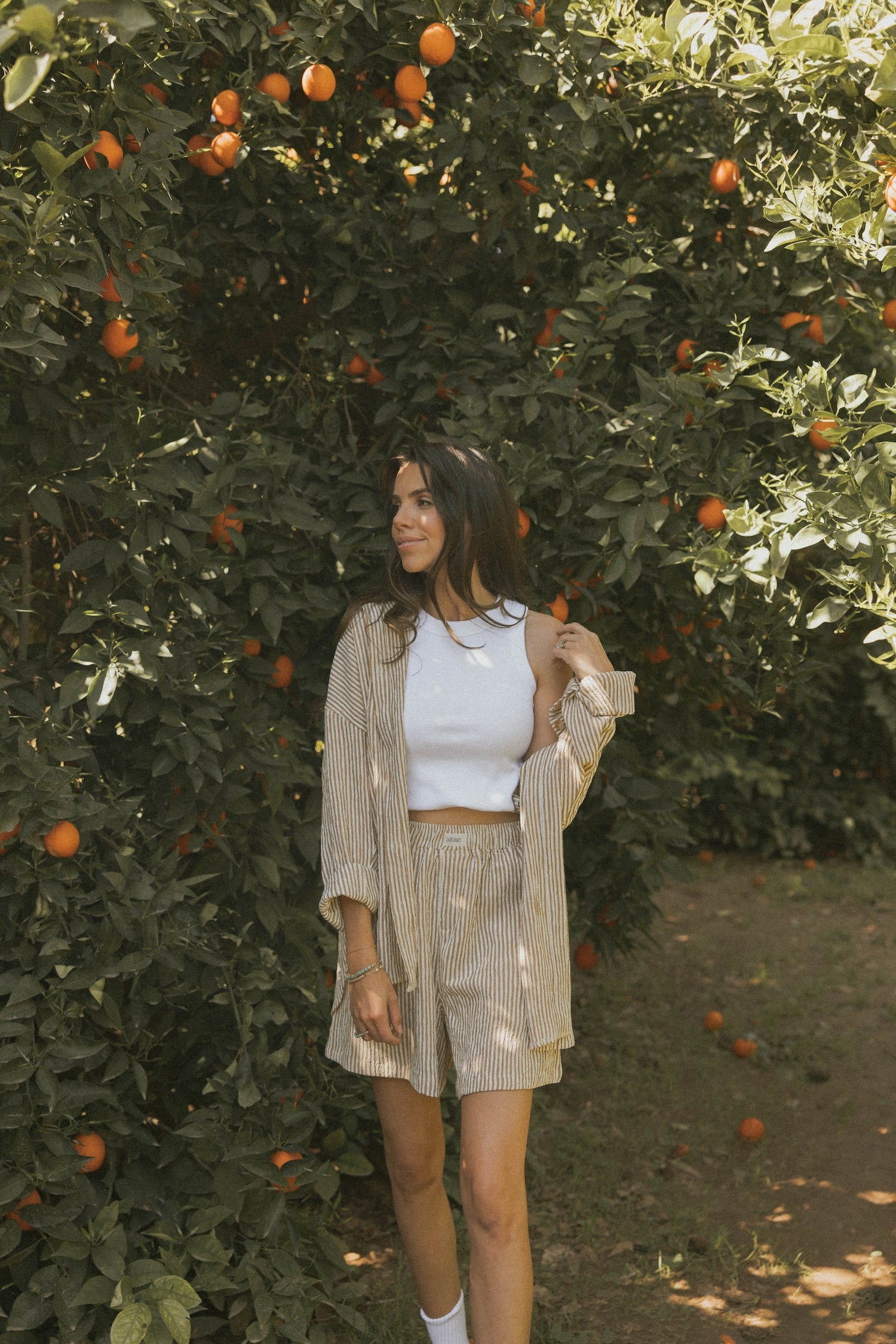 Striped matching shorts and top set for women.