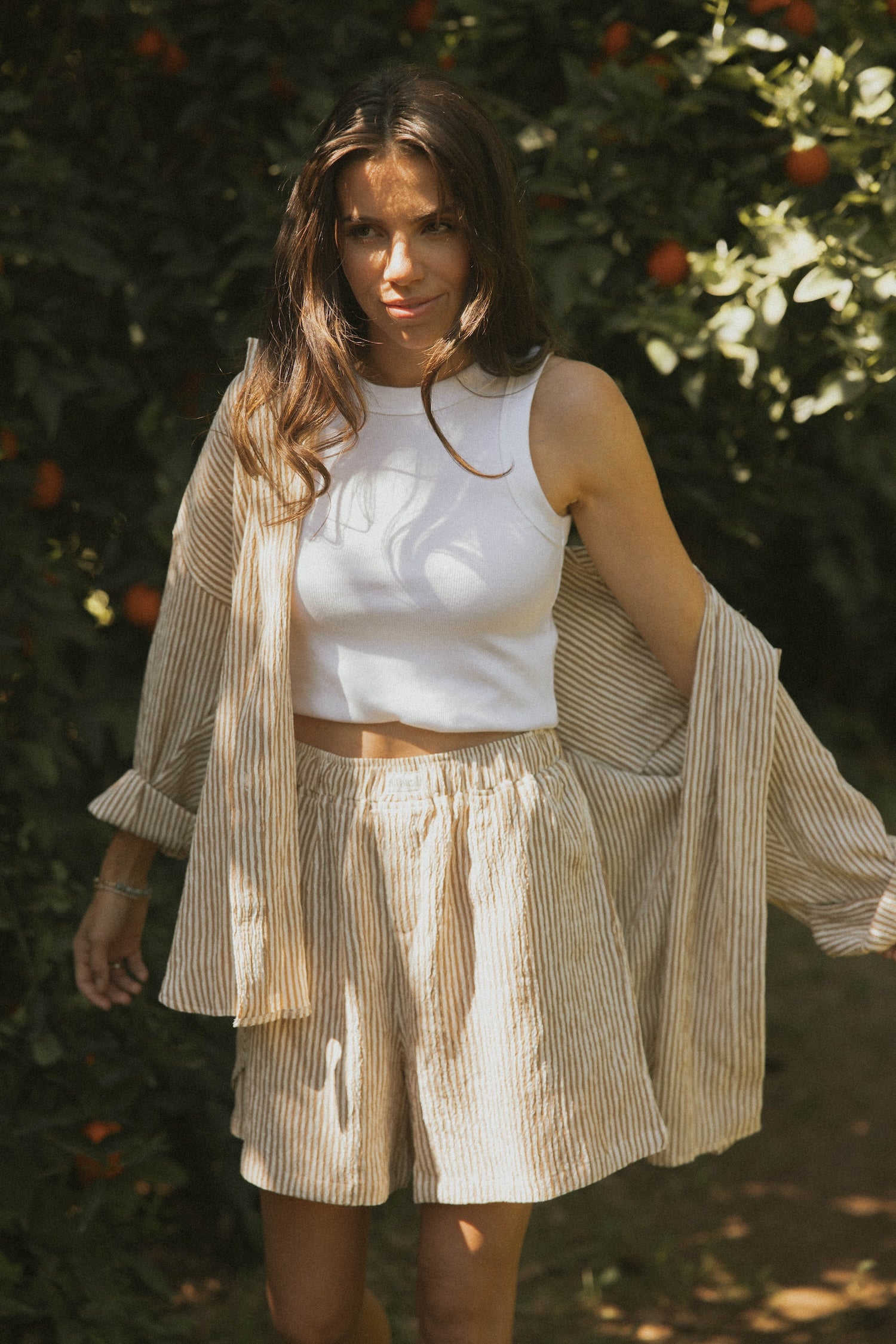 Striped matching shorts and top set for women.
