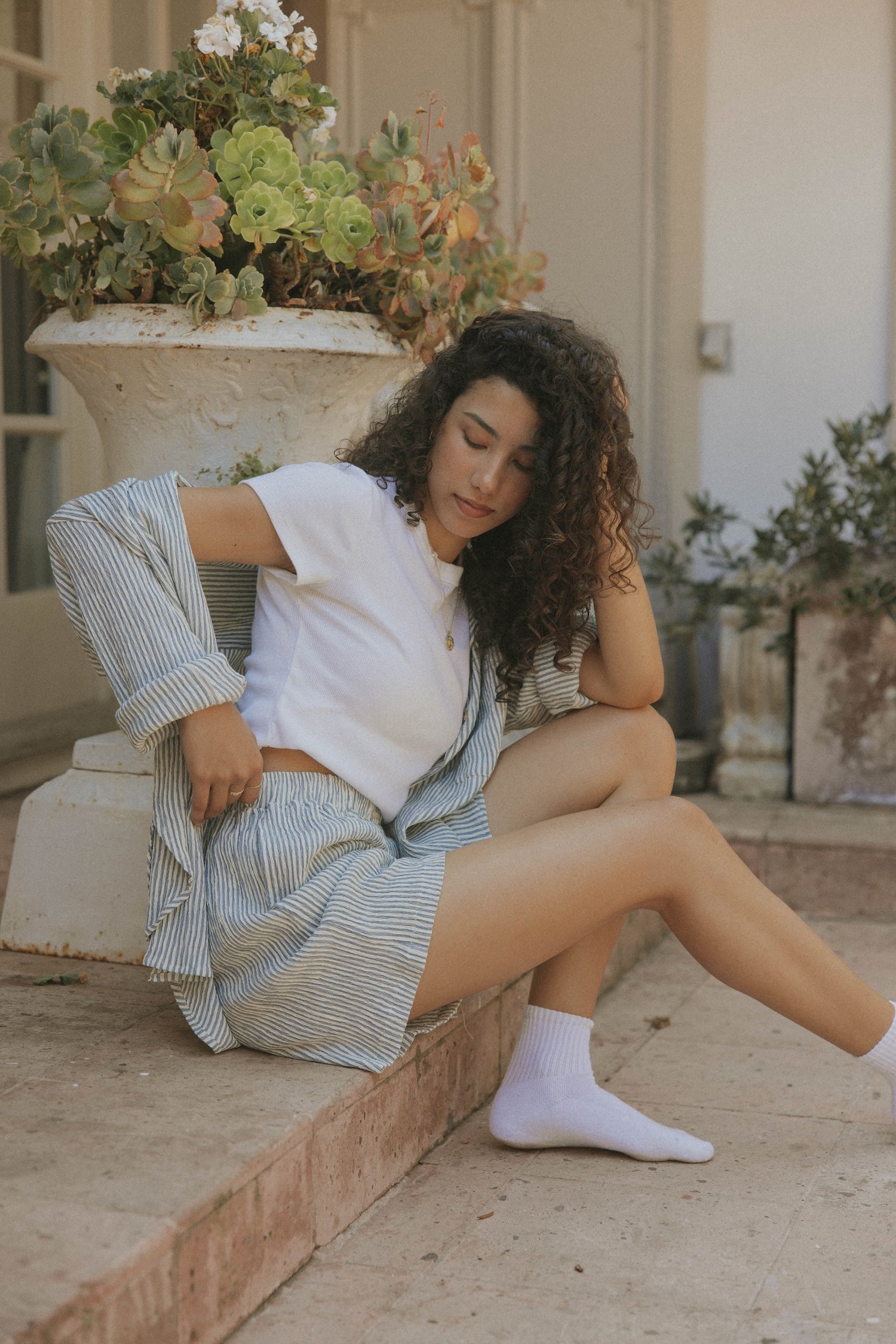 Striped matching shorts and top set for women.