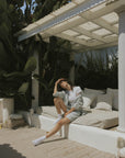 Striped matching shorts and top set for women.