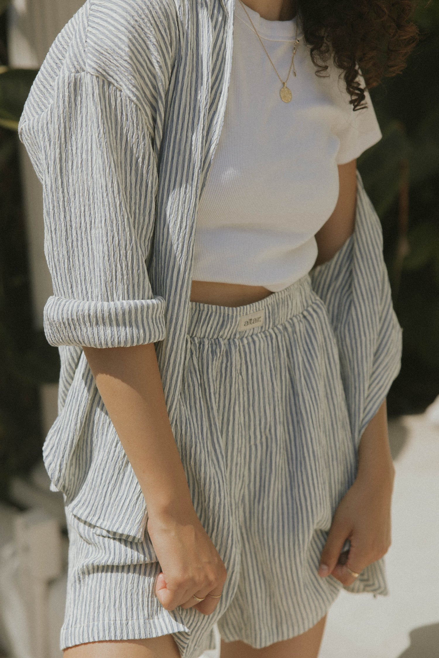 Striped matching shorts and top set for women.