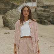 Striped matching shorts and top set for women.