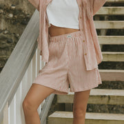 Striped matching shorts and top set for women.