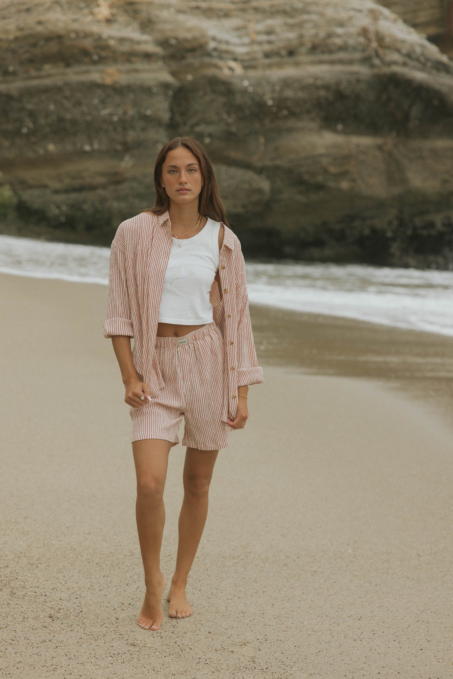 Striped matching shorts and top set for women.