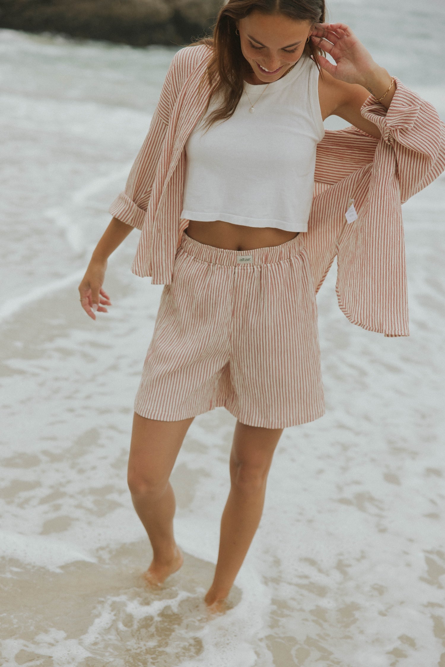 Striped matching shorts and top set for women.