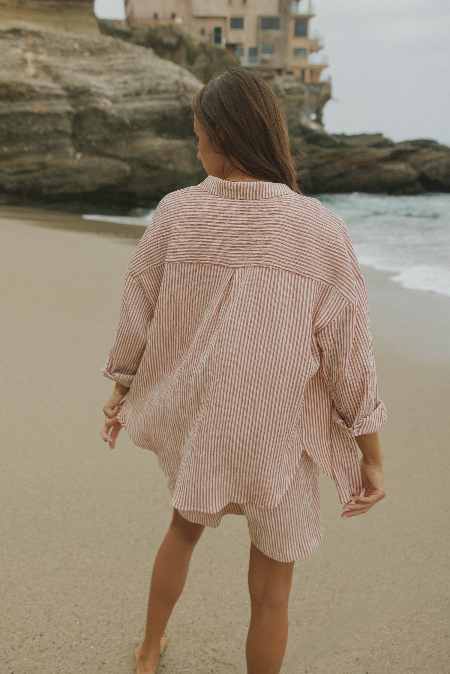 Striped matching shorts and top set for women.