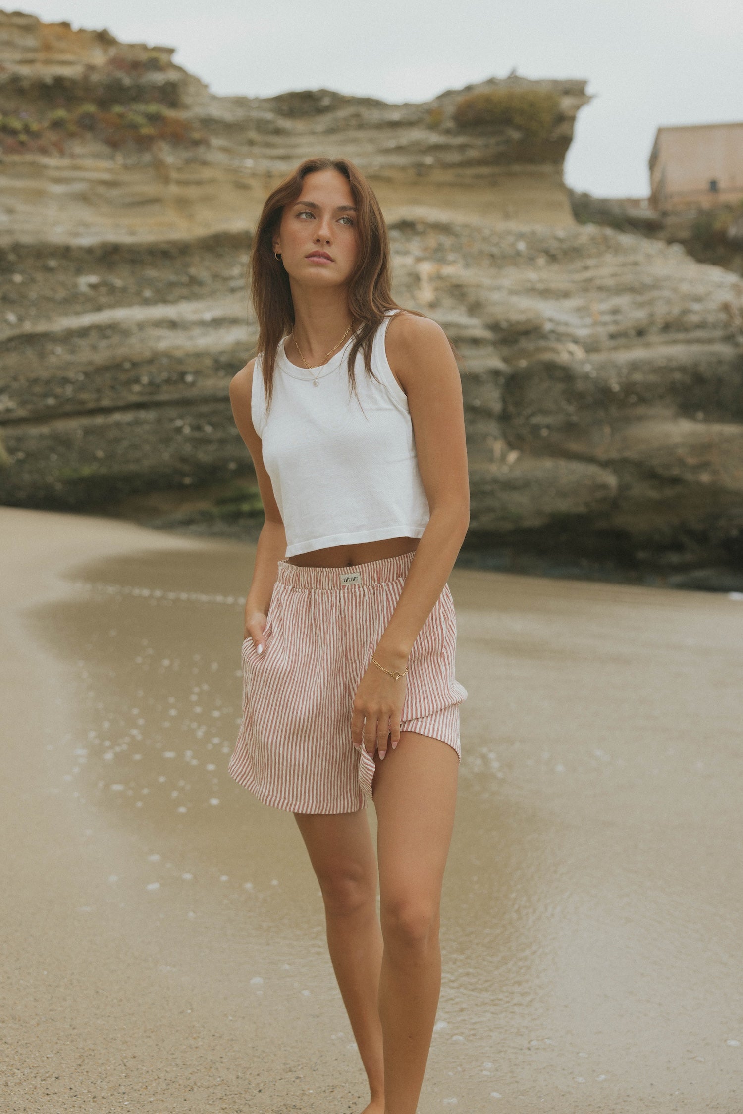 Striped matching shorts and top set for women.