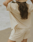 Neutral matching beachwear set for women.