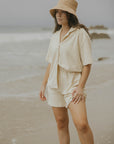 Neutral matching beachwear set for women.