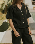 Black muslin nursing-friendly top for women.