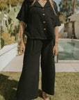 Women's wide leg lounge pants in black muslin.