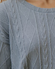 Cable knit sweater top for women.
