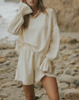 Mid-length muslin beach shorts for women in cream.