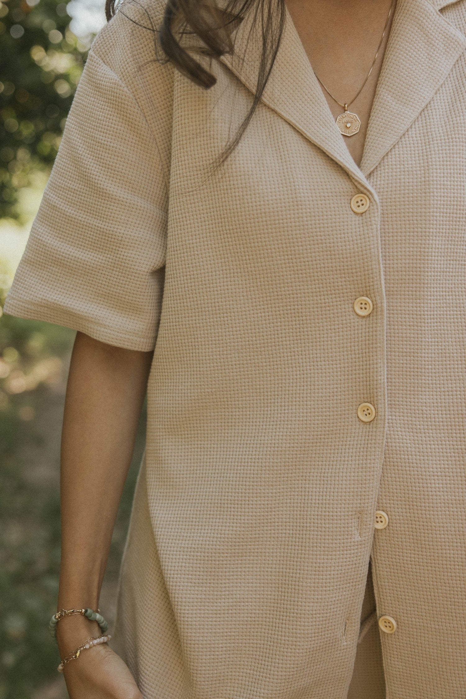Women&#39;s neutral waffle knit shirt.