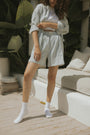 Striped matching shorts and top set for women.
